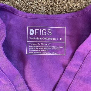 FIGS one pocket scrub top in bright purple. Size medium.